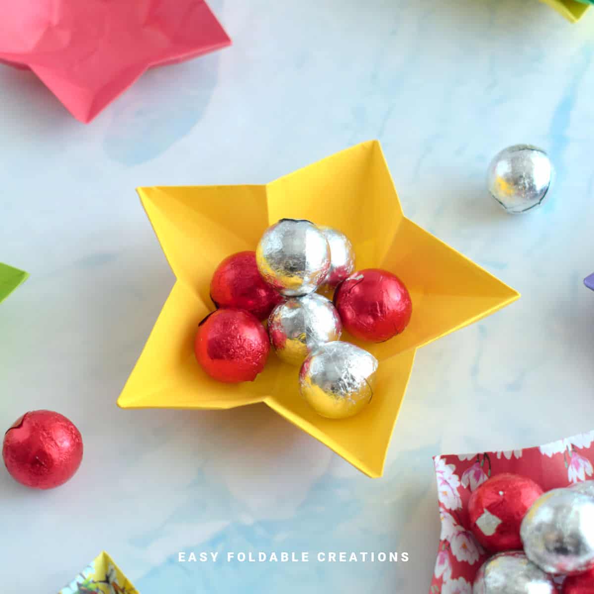 Close up image of a star bowl with chocolates.