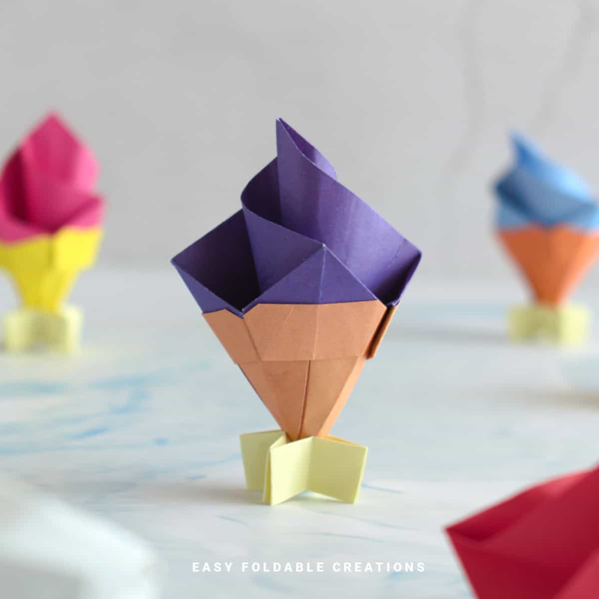 Close up image of a purple origami ice cream.