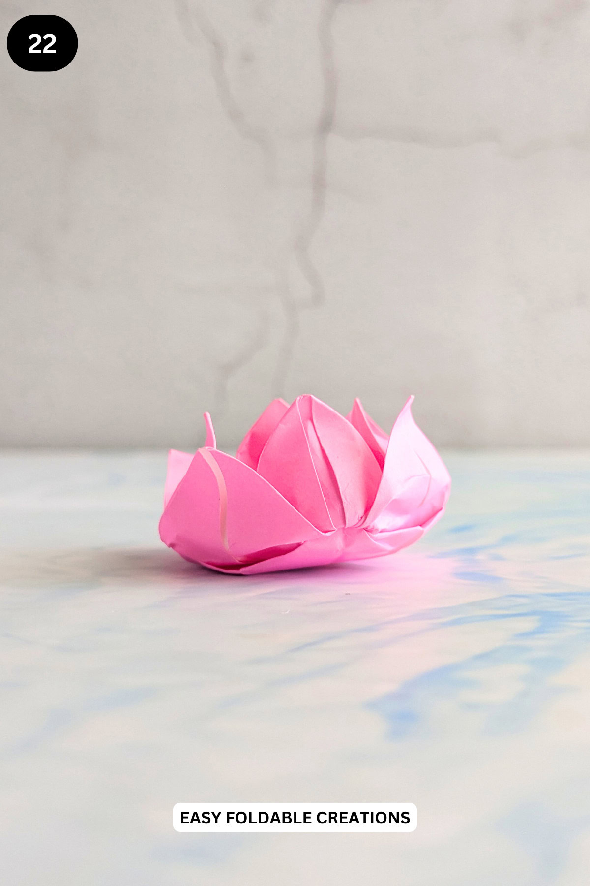 Step 22 for folding an origami lotus.