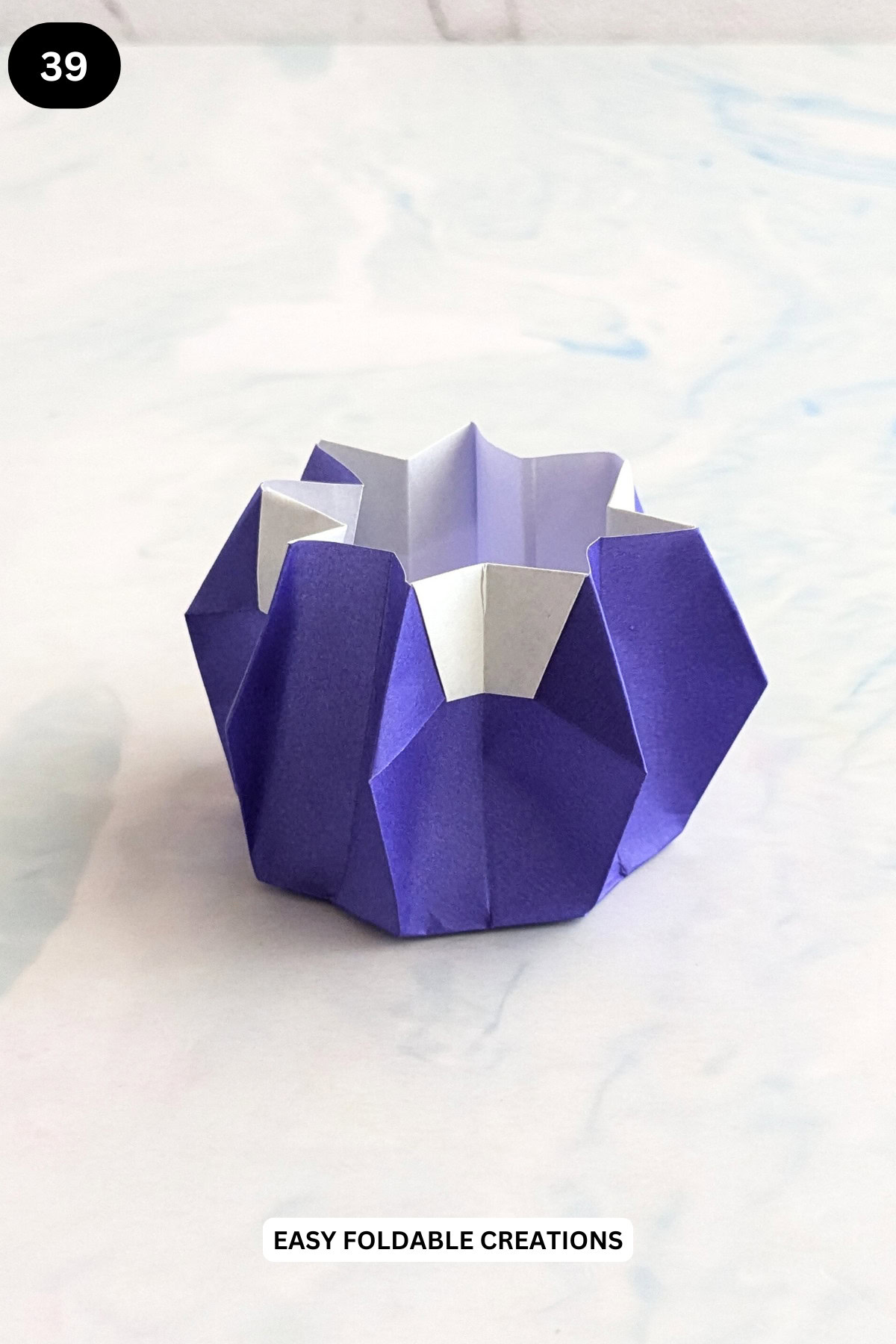 Step 39 for folding an easy origami bowl.