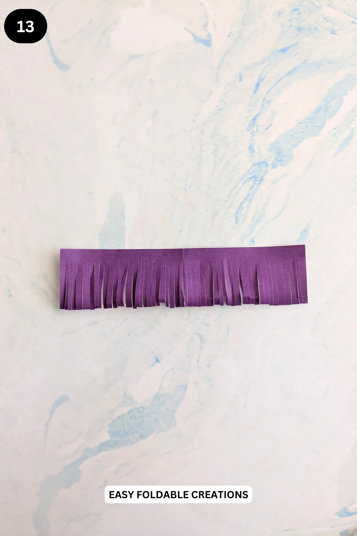 Step 13 for making the simple paper flower petals.