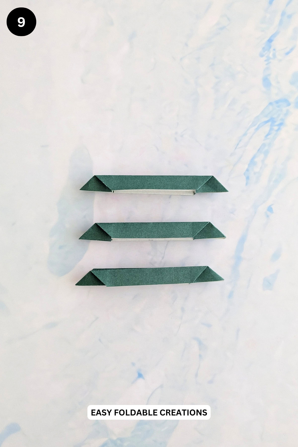 Step 9 for folding the leaves for paper roses.