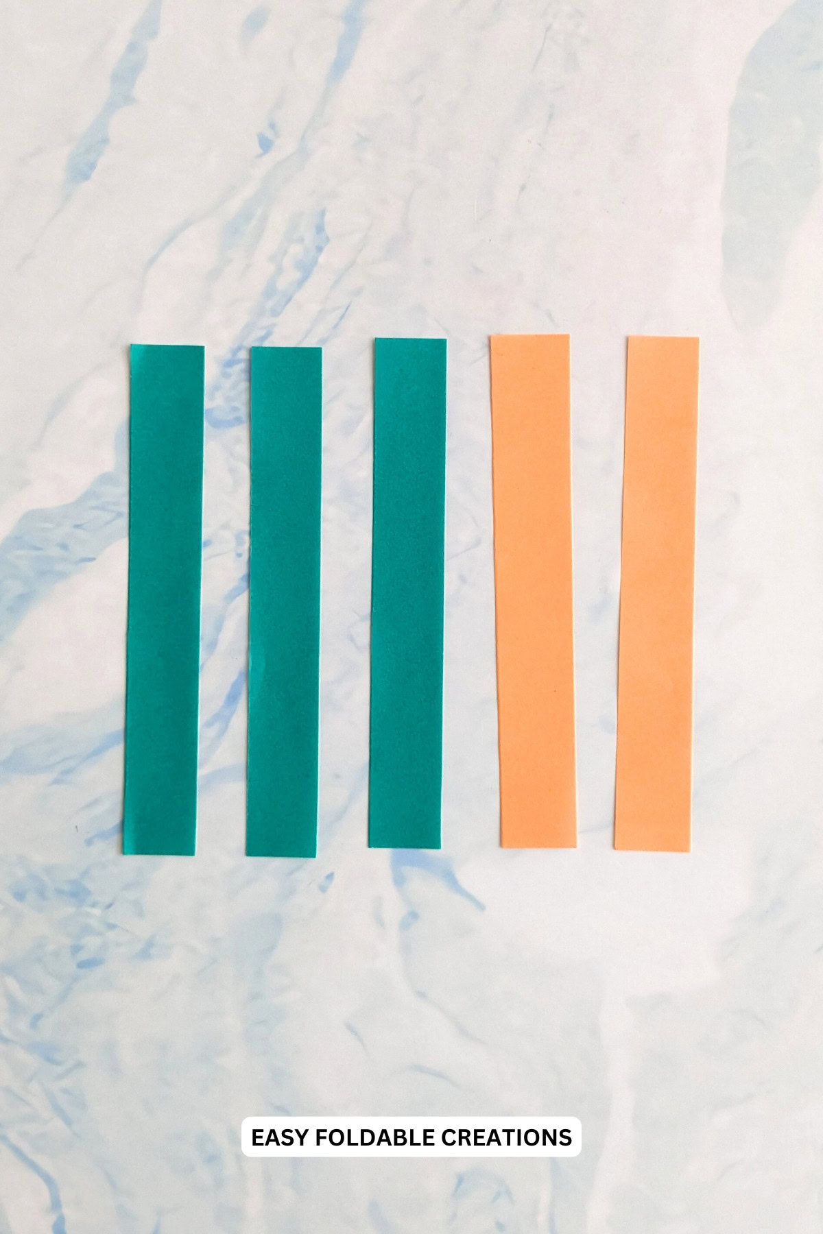 Materials for easy paper carrots.