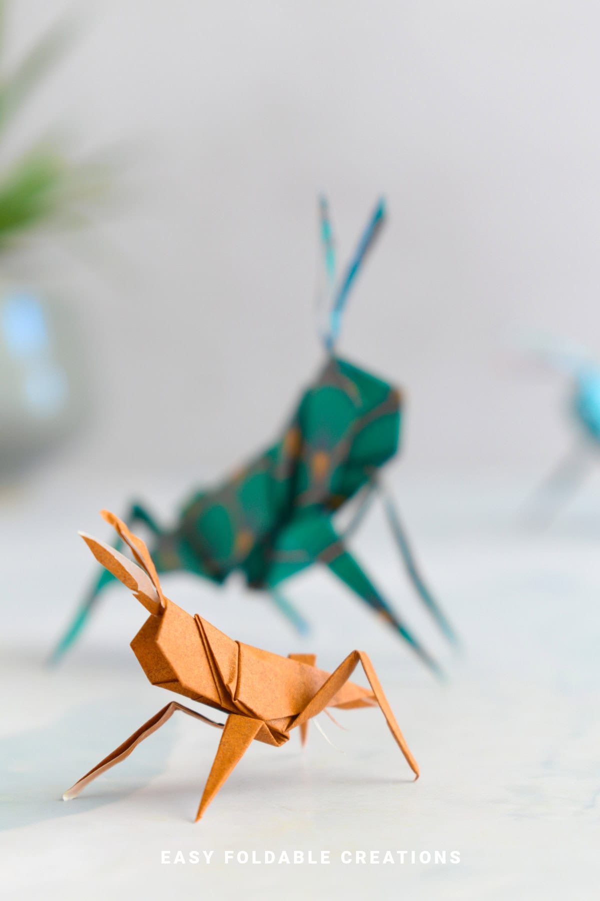 Close up image of a paper grasshopper.