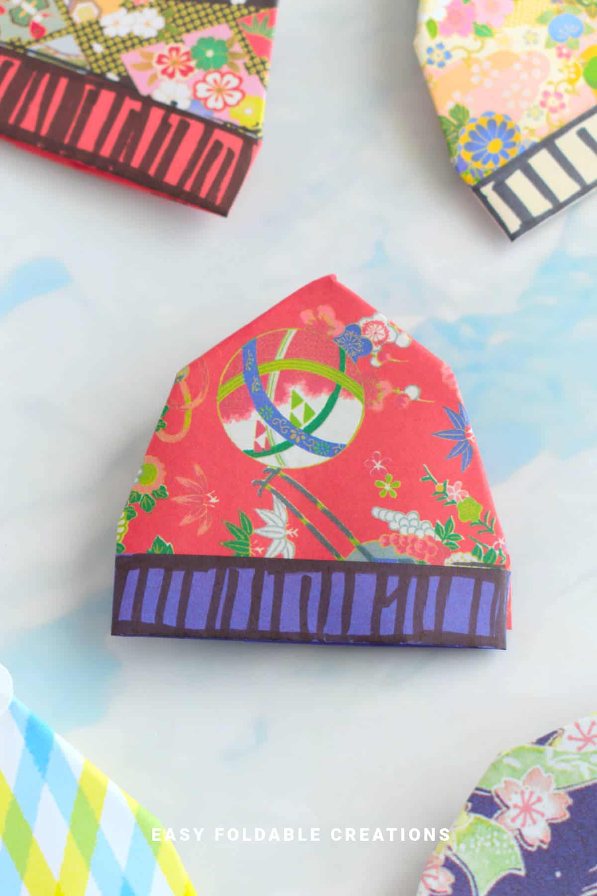 Red and purple origami beanie.