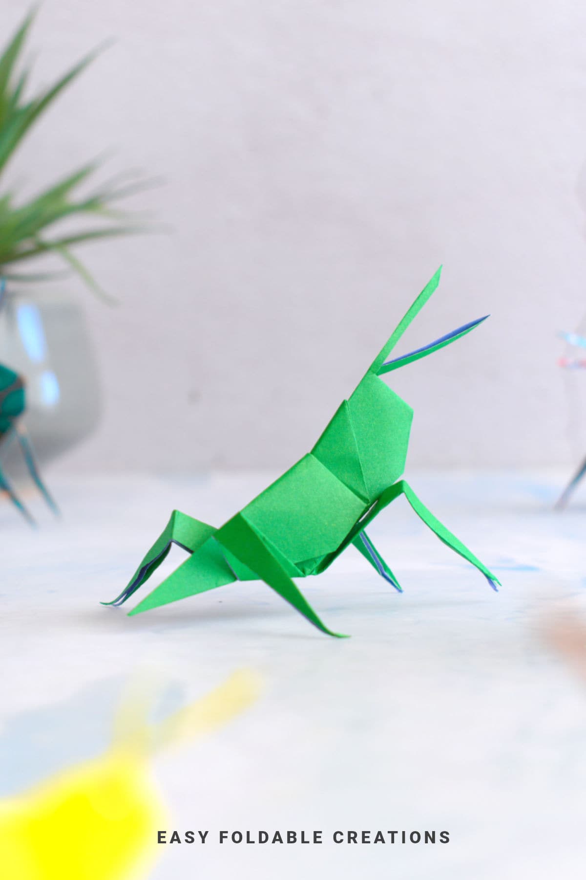 Green origami grasshopper.
