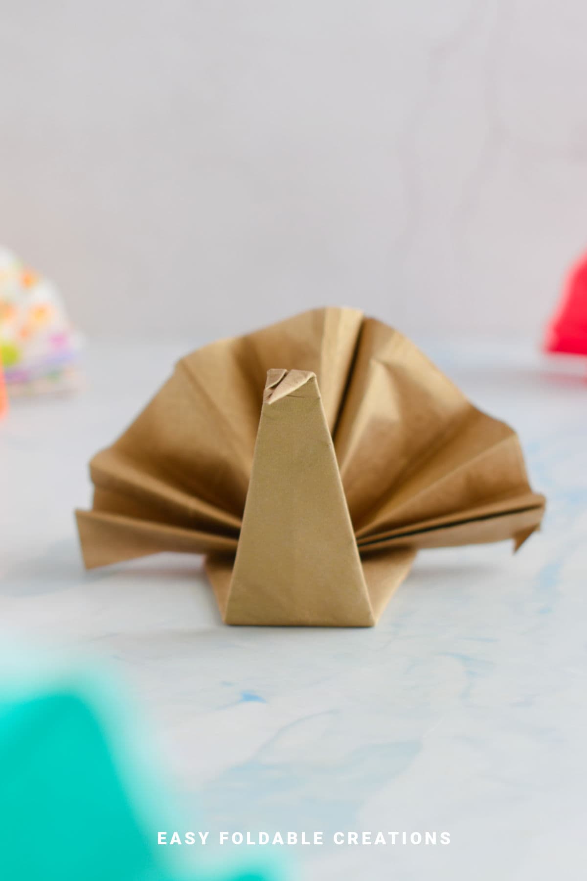 Gold turkey napkin fold.