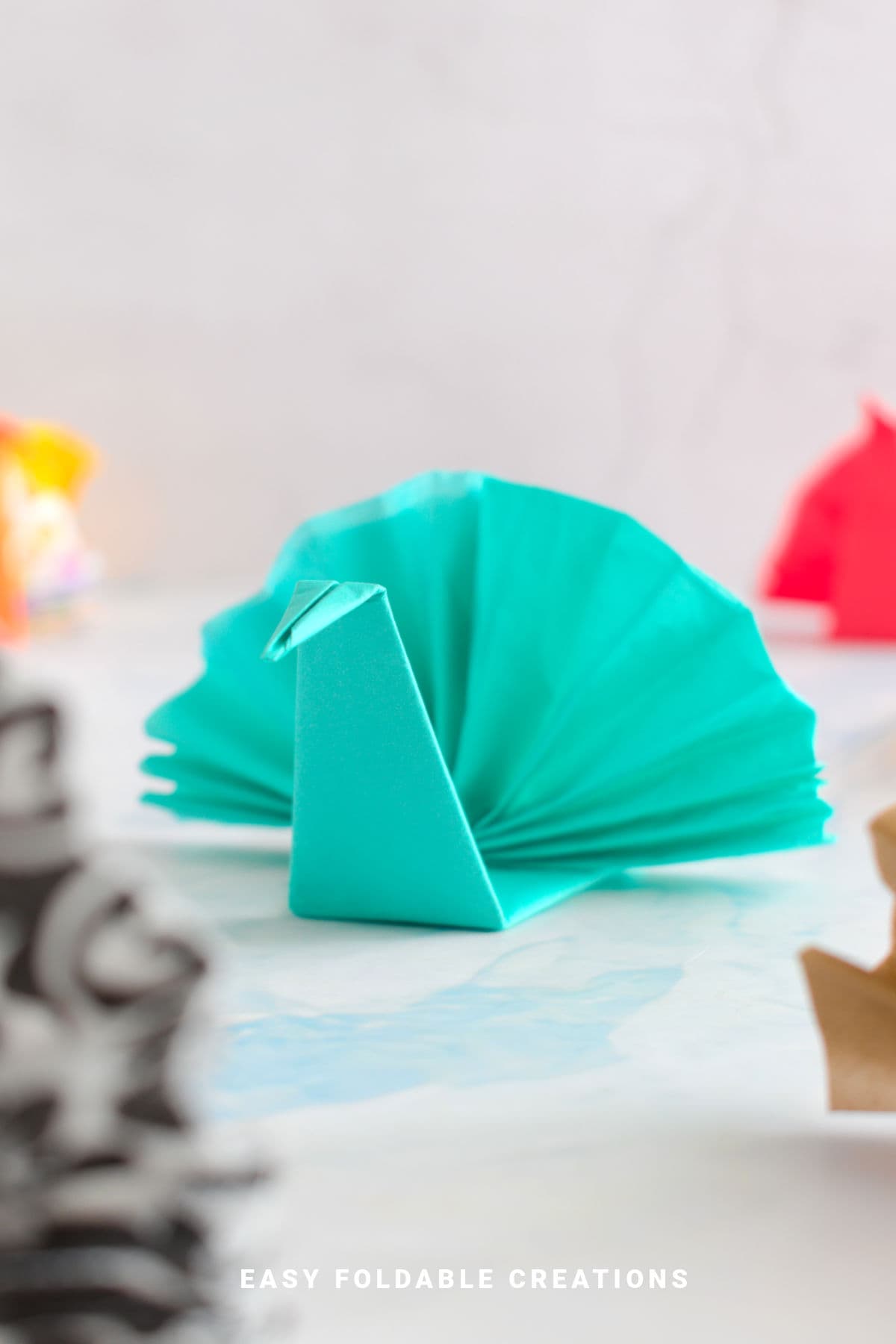 Blue turkey napkin fold.