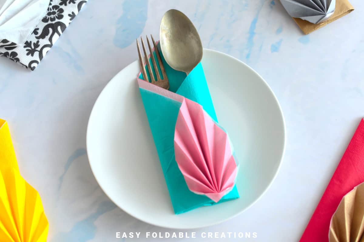 Blue and pink napkin fold.