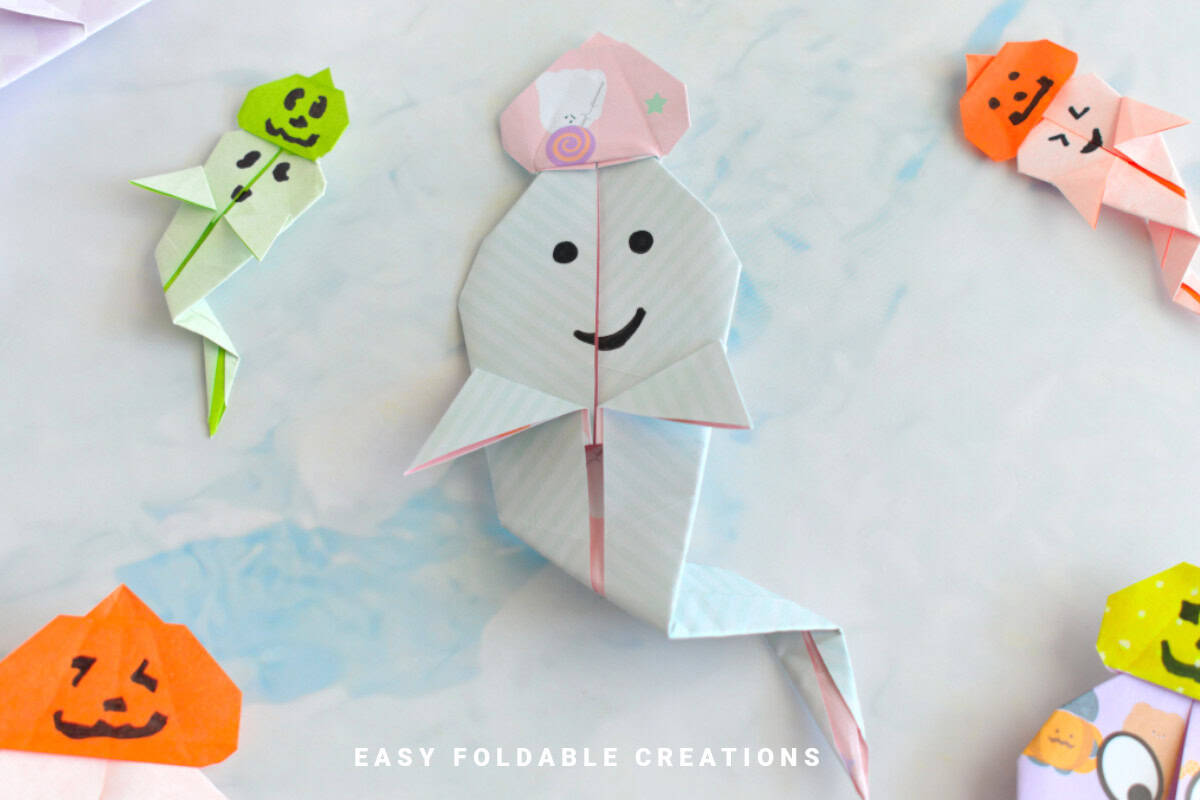 Origami ghost with pumpkin hat.