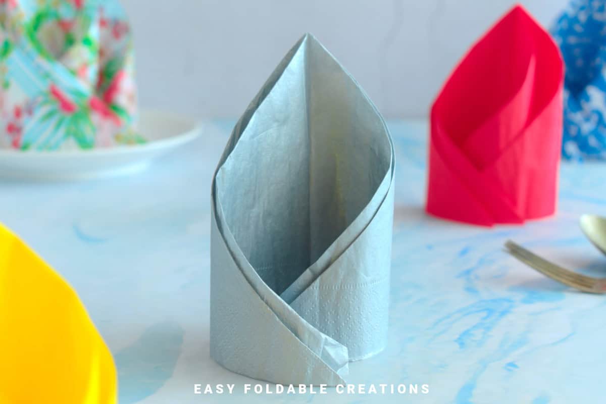 Close up image of a spiral napkin fold.
