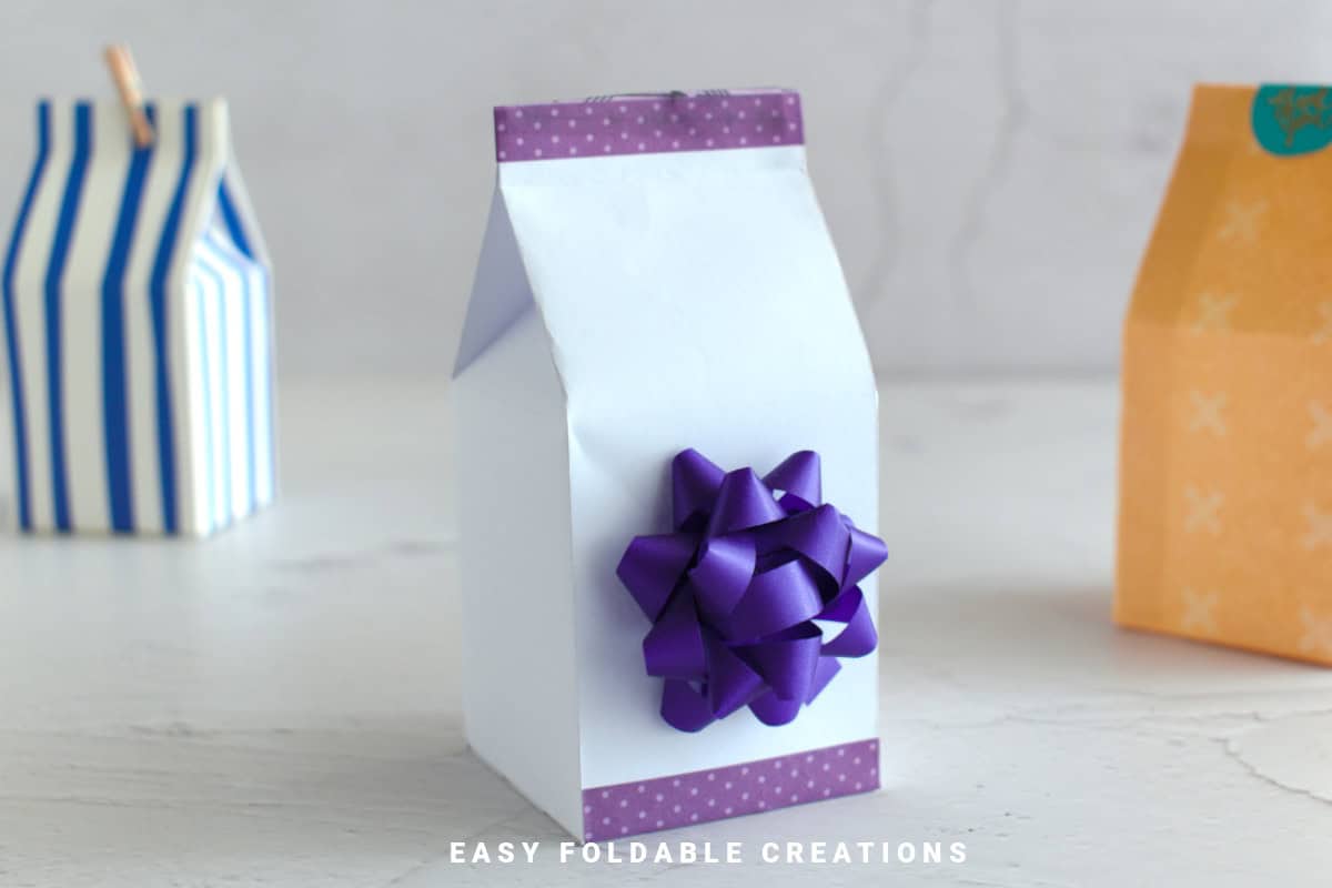 Close up image of a paper milk carton gift box.