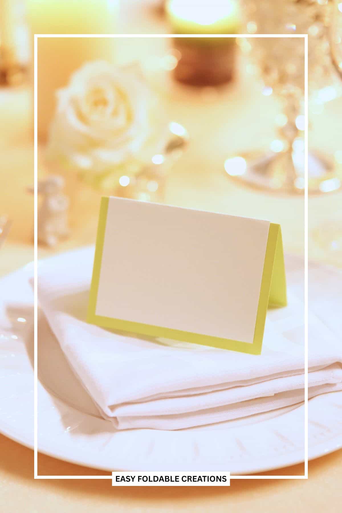 Folded place card on a napkin and plate.